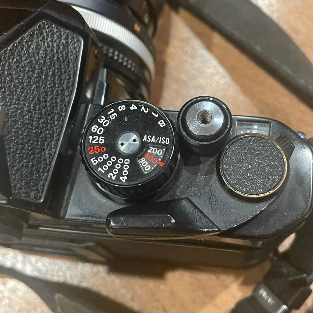 Vintage Nikon FM2 black camera with lens